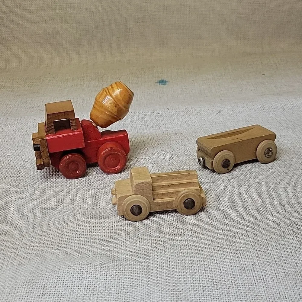 Assorted small wood‎ vehicles..train, dumo truck, race cars...